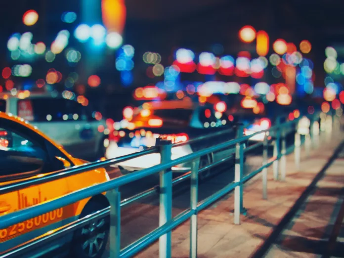 Barrier along nighttime city street