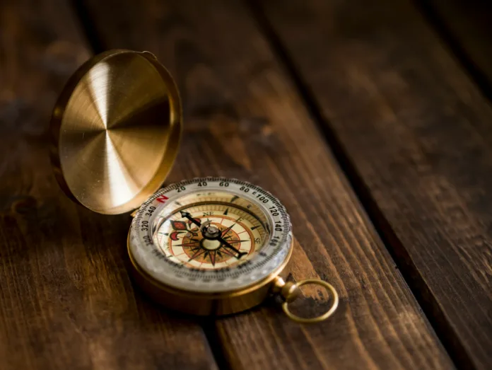 Compass on a wooden table