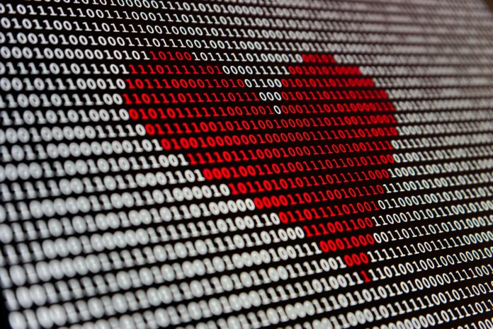 Red heart highlight amid binary code