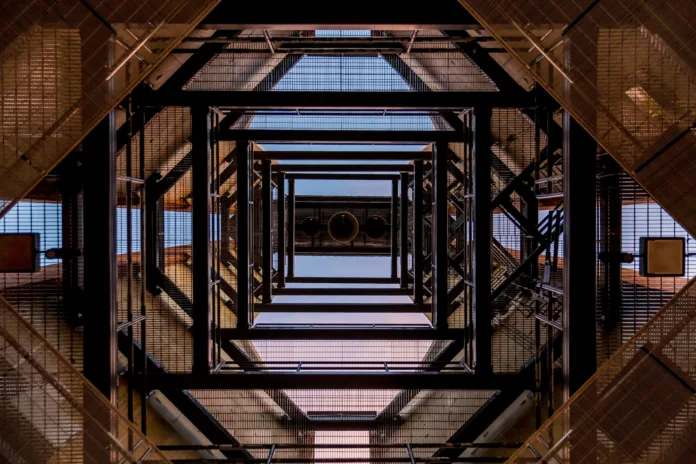 Steel beams forming the framework of a tall building, shot from below